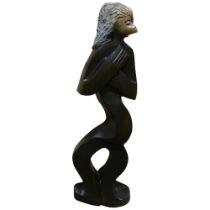 A large African carved spring stone sculpture, The Mermaid by Witness Bonjisi, height 108cm Good