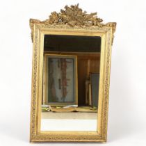 A 19th century Pier-glass mirror with gilt gesso frame, 128 x 78cm Slight damage to high points of