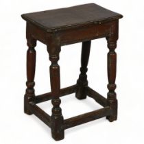 A 17/18th century oak joint stool, with turned baluster legs, height 55cm, top 43 x 26cm Some