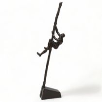 Contemporary modernist patinated bronze sculpture, figure climbing a pole, impressed monogram JP,