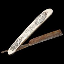 Swedish silver-mounted cut-throat razor, stamped JOH Engstrom, Elkilstonia Sweden, relief cherub