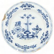 Delft blue and white tin glazed pottery plate, with painted decoration, diameter 34cm Several