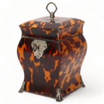 A small 19th century tortoiseshell square ogee sided tea caddy, unmarked silver mounts on engraved