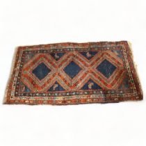 An antique Turkish rug with three central Lozenge, 191 x 102cm 25cm repair and two small hols from