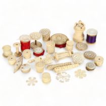 A group of 19th century bone and mother-of-pearl sewing items, cotton reels, needle cases etc