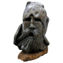 An impressive granite or marble carved sculpture, head of a Norse god, unsigned, on naturalistic