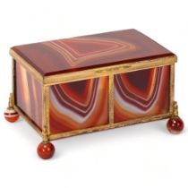 A large 19th century polished agate and gilt-metal casket, on agate ball feet, 11cm x 7cm x 7cm