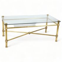 A 20th Century brass framed coffee table with glass top, height 70cm, top 110 x 55.5cm Good