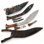 2 Second War Period kukri knives in leather sheaths, with original miniature knives