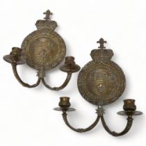 A pair of 19th century bronze twin-branch candle wall sconces, with King Henry IV of France armorial