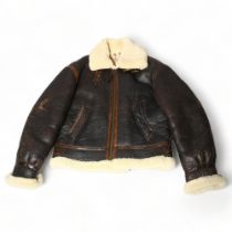 A good quality pilot aviator style jacket, brown leather and fleece-lined, size small/medium Good