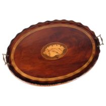 A Georgian mahogany tray with inlay boxwood conch shell motif and brass handles, length 69cm Two