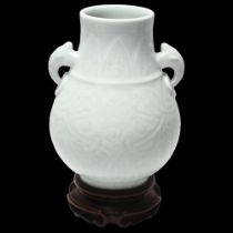 Chinese white glaze porcelain 2-handled vase, impressed geometric designs, seal mark under, on