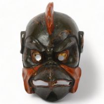 Japanese Gigaku mask, carved wood with red gold and green lacquer, Meiji Period, height 30cm Several