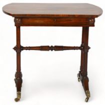A small Victorian rosewood writing table in the manner of Gillows, with frieze drawer and