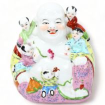 A Chinese porcelain seated Buddha with children, height 22cm Perfect condition, no restoration