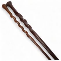 An African hardwood spiral twist ceremonial staff, and a similar hardwood twist design stick (2) The