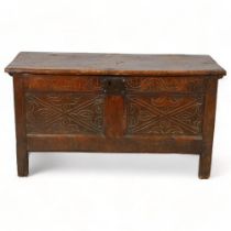 A small sized 18th century oak coffer, with carved front and plank top and back, height 58cm, 98 x