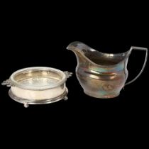 A George III silver helmet cream jug, London 1807, and a George V silver butter dish, diameter 9.