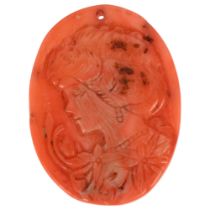 An Art Nouveau coral cameo panel pendant, relief carved depicting female profile with flowers, 35.