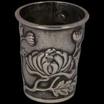 A Chinese export silver 'chrysanthemum' drinking tot, retailed by Wang Hing, relief embossed