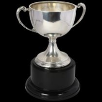 An Art Deco George V silver 2-handled trophy cup on stand, indistinct maker, Birmingham 1934,