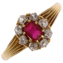 An early/mid 20th century ruby and diamond oval cluster ring, claw set with 0.35ct oval mixed-cut