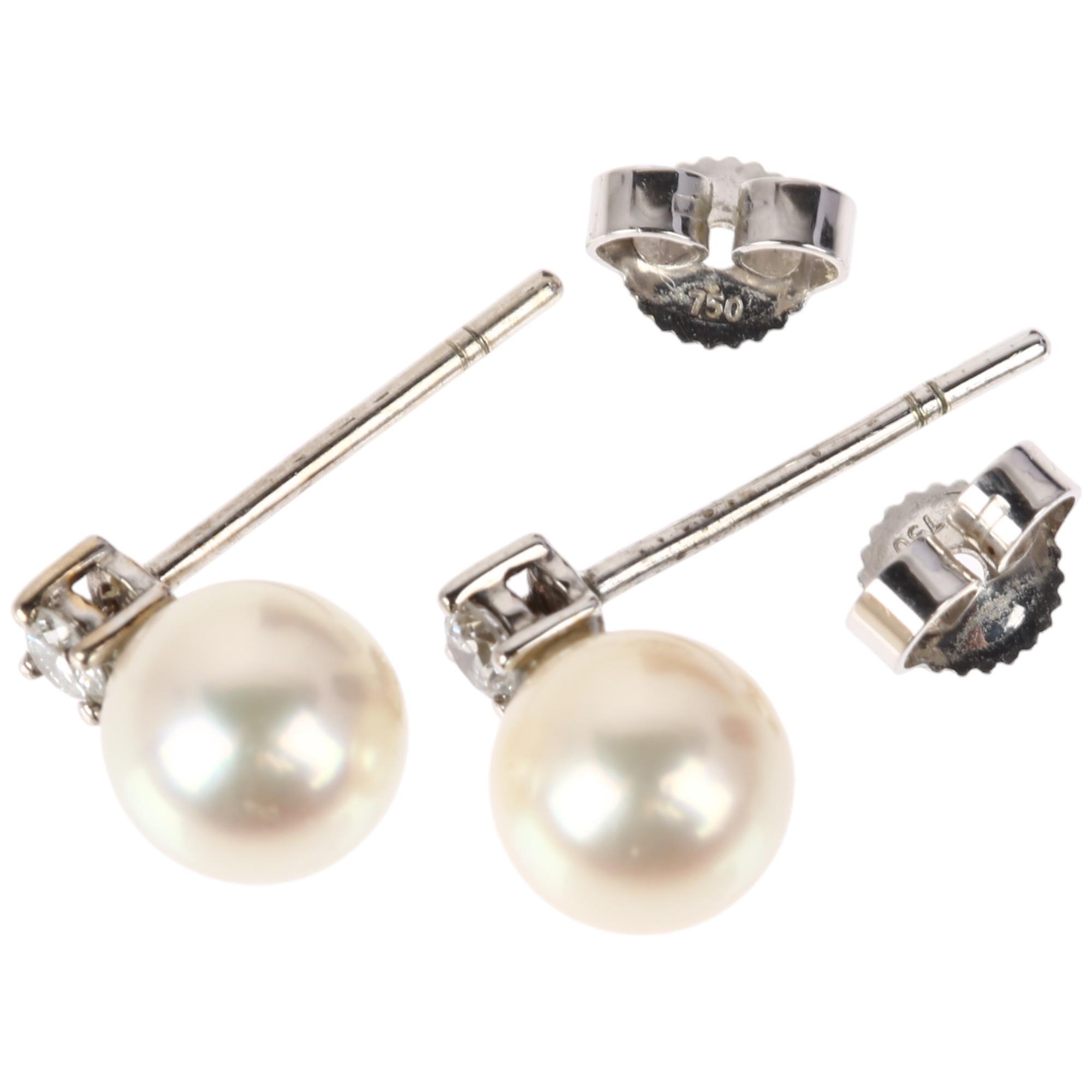 A pair of 18ct white gold whole pearl and diamond earrings, each claw set with 0.07ct modern round - Image 2 of 4