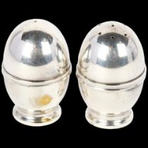 A pair of Danish silver egg pepperettes, Scandinavisk Guld & Solv, 5.5cm, 1.5oz total No damage or