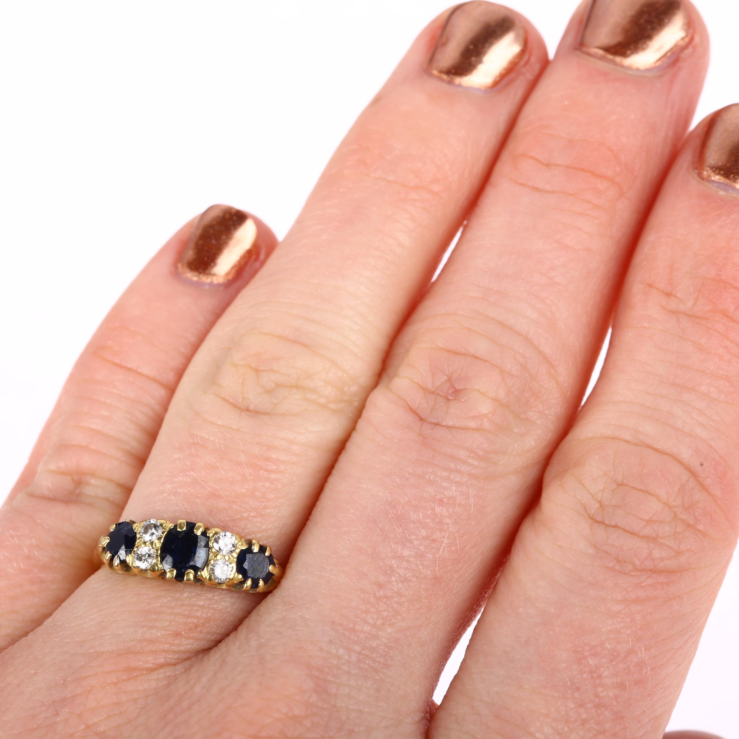 An early 20th century 18ct gold seven stone sapphire and diamond half hoop ring, set with oval and - Image 4 of 4