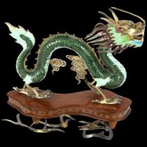 A Chinese silver-gilt cloisonne enamel dragon figure, realistically modelled with auspicious cloud