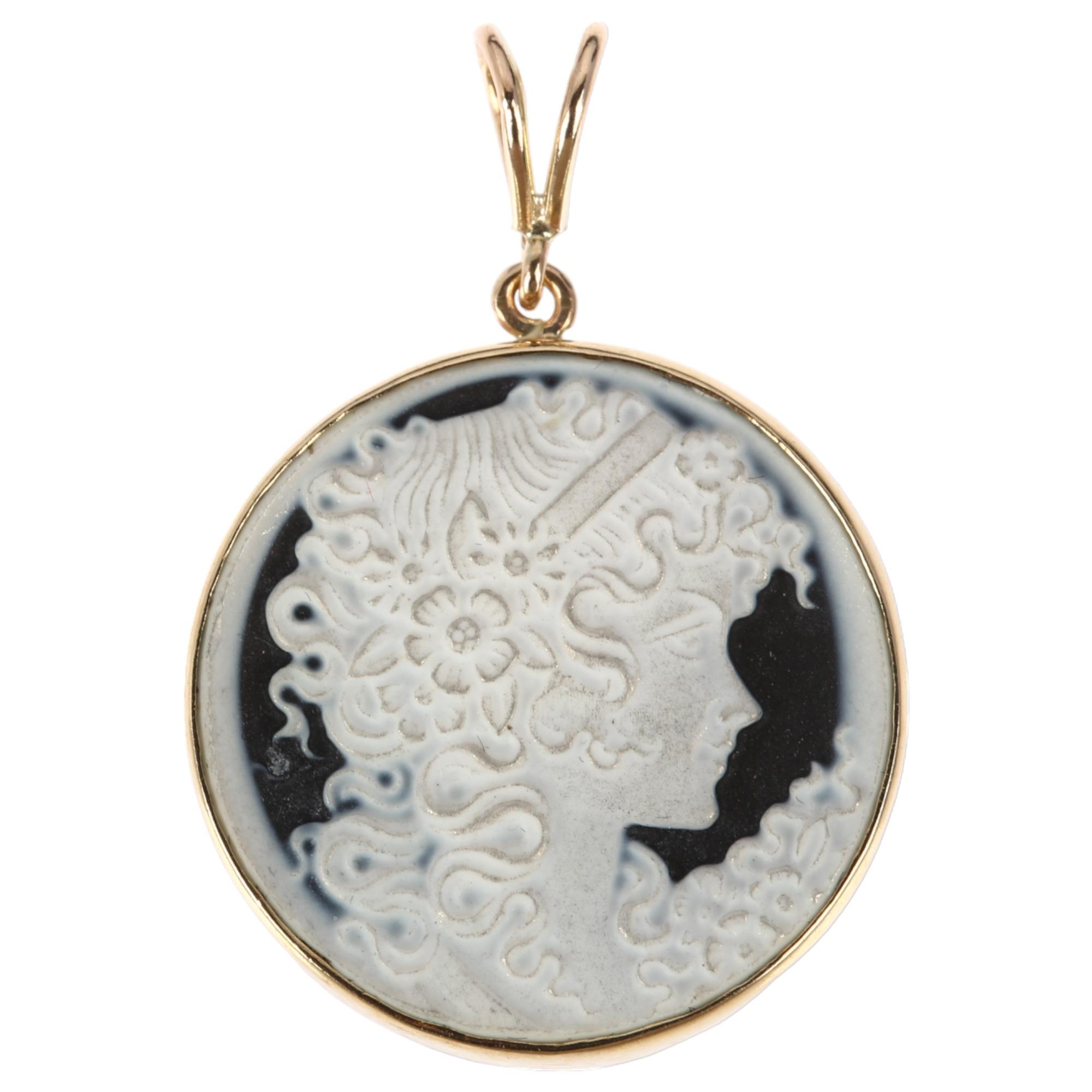 A late 20th century 9ct gold black glass cameo pendant, relief moulded depicting Art Nouveau