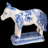 Delft blue and white pottery horse, length 17cm, height 15cm Light glaze crazing and tiny glaze