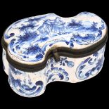 Delft blue and white pottery box of shaped form, hinged metal rim, length 9.5cm Hinge pin is