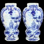 Pair of Delft blue and white pottery jars, decorated with country figures, height 16cm 1 vase has