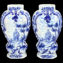 Pair of Delft blue and white pottery jars, decorated with country figures, height 16cm 1 vase has
