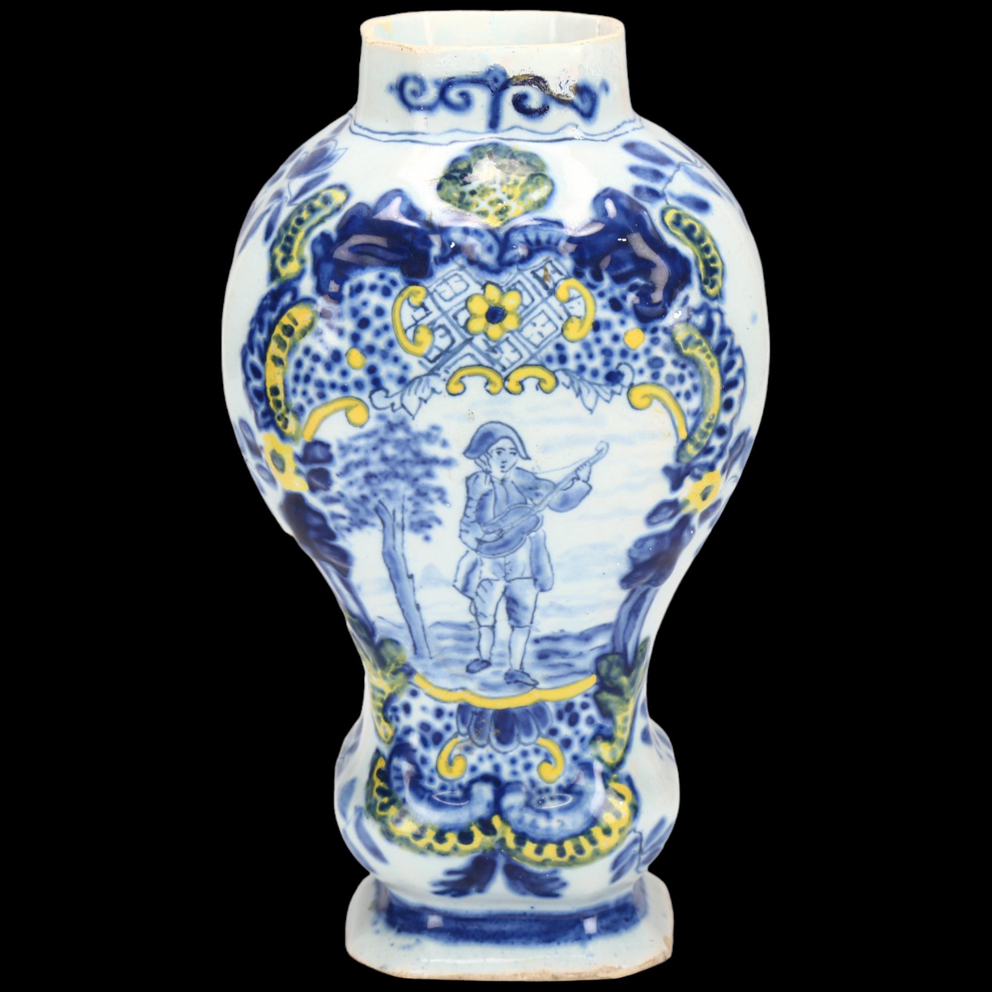 Delft polychrome pottery jar, decorated with a musician, height 14cm Rim has been professionally