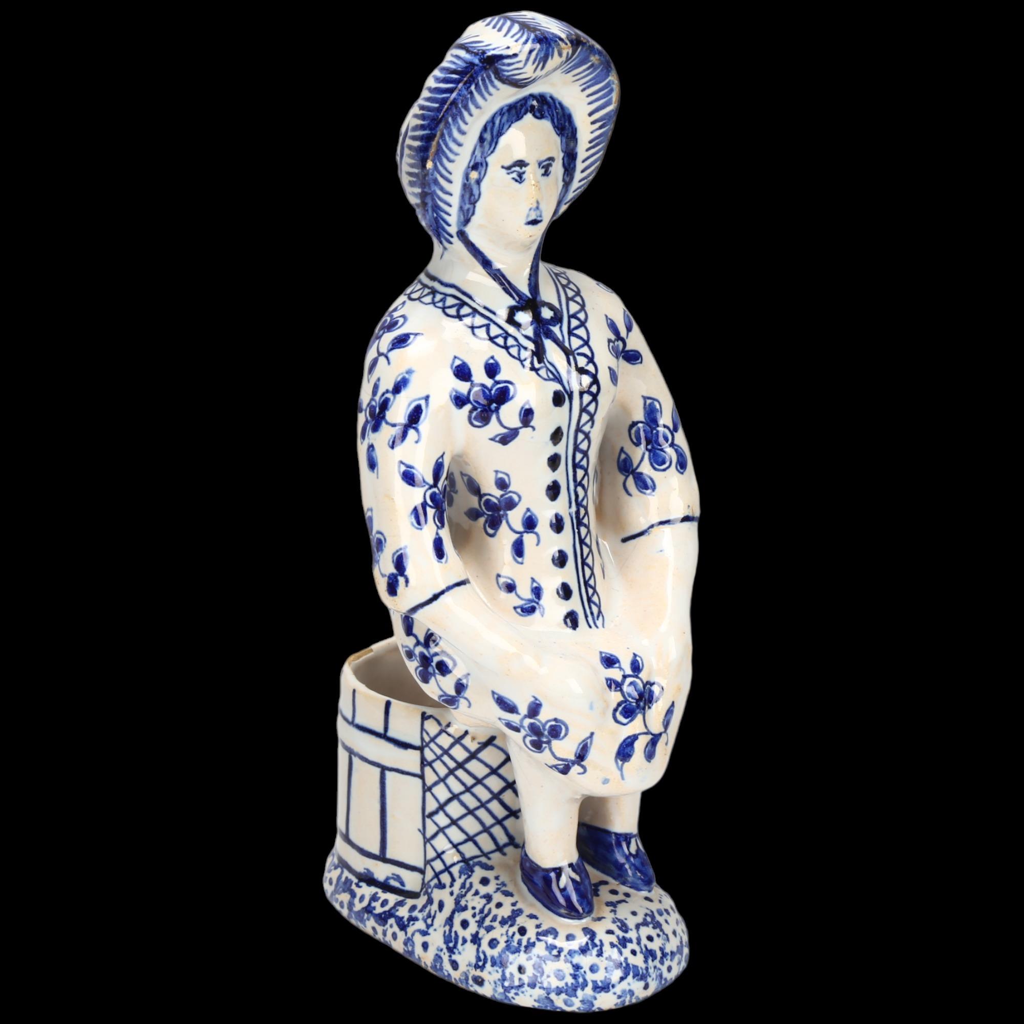 Delft blue and white pottery table salt figure, height 18cm Minor glaze rubbing around the edge of