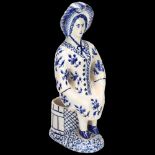 Delft blue and white pottery table salt figure, height 18cm Minor glaze rubbing around the edge of