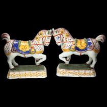 Pair of Delft polychrome pottery saddled horses, height 21cm, base length 17cm Glaze chip on 1