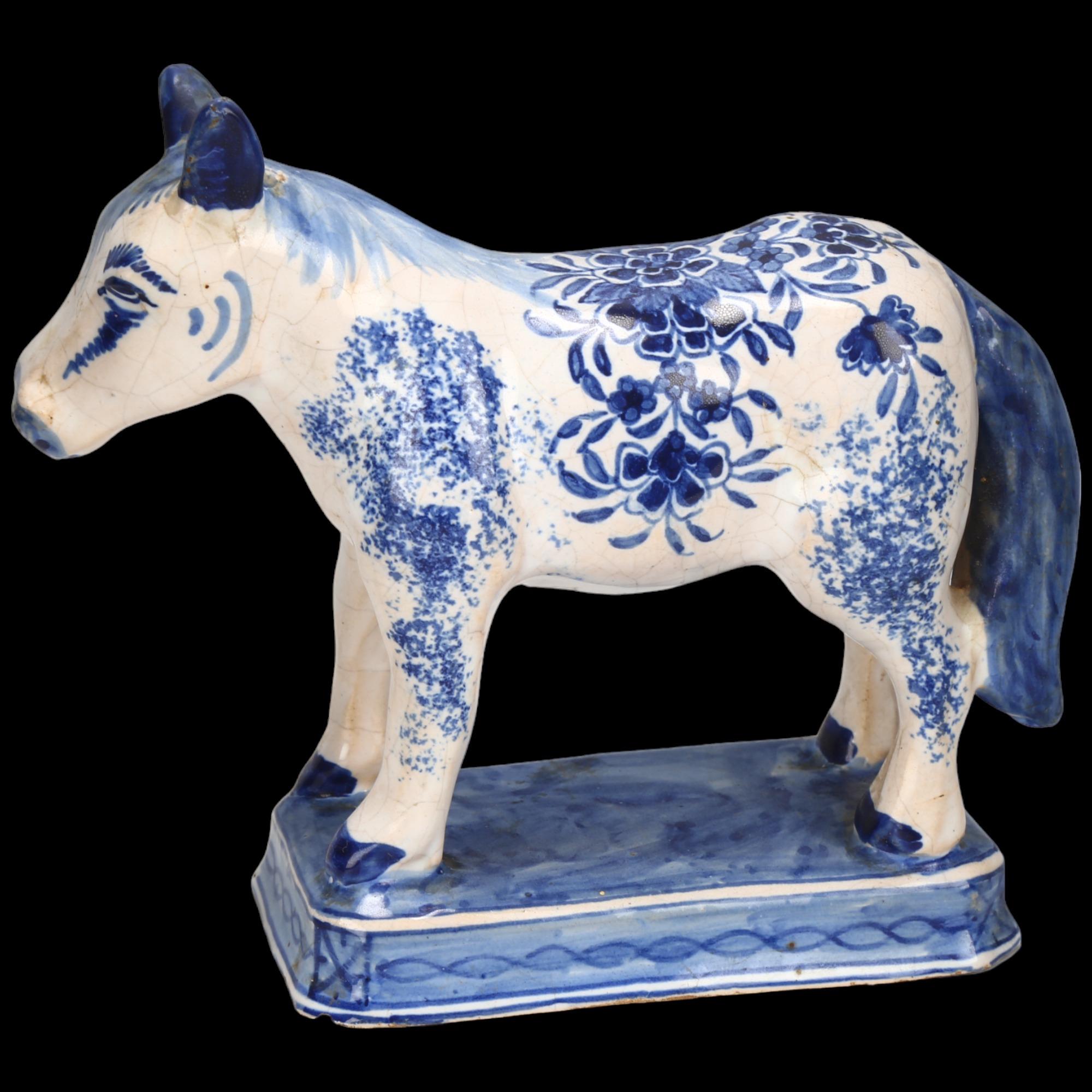 Delft blue and white pottery horse, length 17cm, height 15cm Light glaze crazing