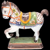 Delft polychrome pottery saddled horse, height 24cm, base length 18cm Good condition
