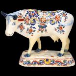 Delft polychrome pottery cow, length 21cm Base and legs have been restored, ears also restored