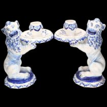 Pair of French blue and white faience figural candlesticks, supported by lions, height 20cm 1