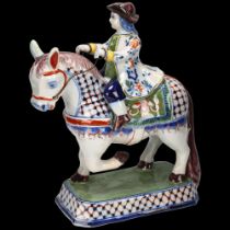 Delft polychrome pottery horse and rider, height 25cm Several very minor glaze rubs
