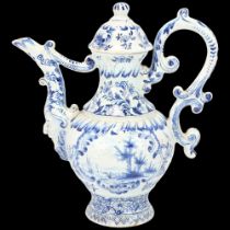 Delft blue and white pottery ewer and cover, height 23cm A few very tiny glaze chips on the tip of