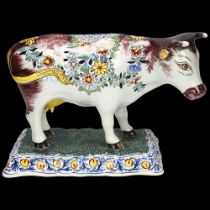 Delft polychrome pottery cow, base length 19cm Horn tips and ears probably broken and restored