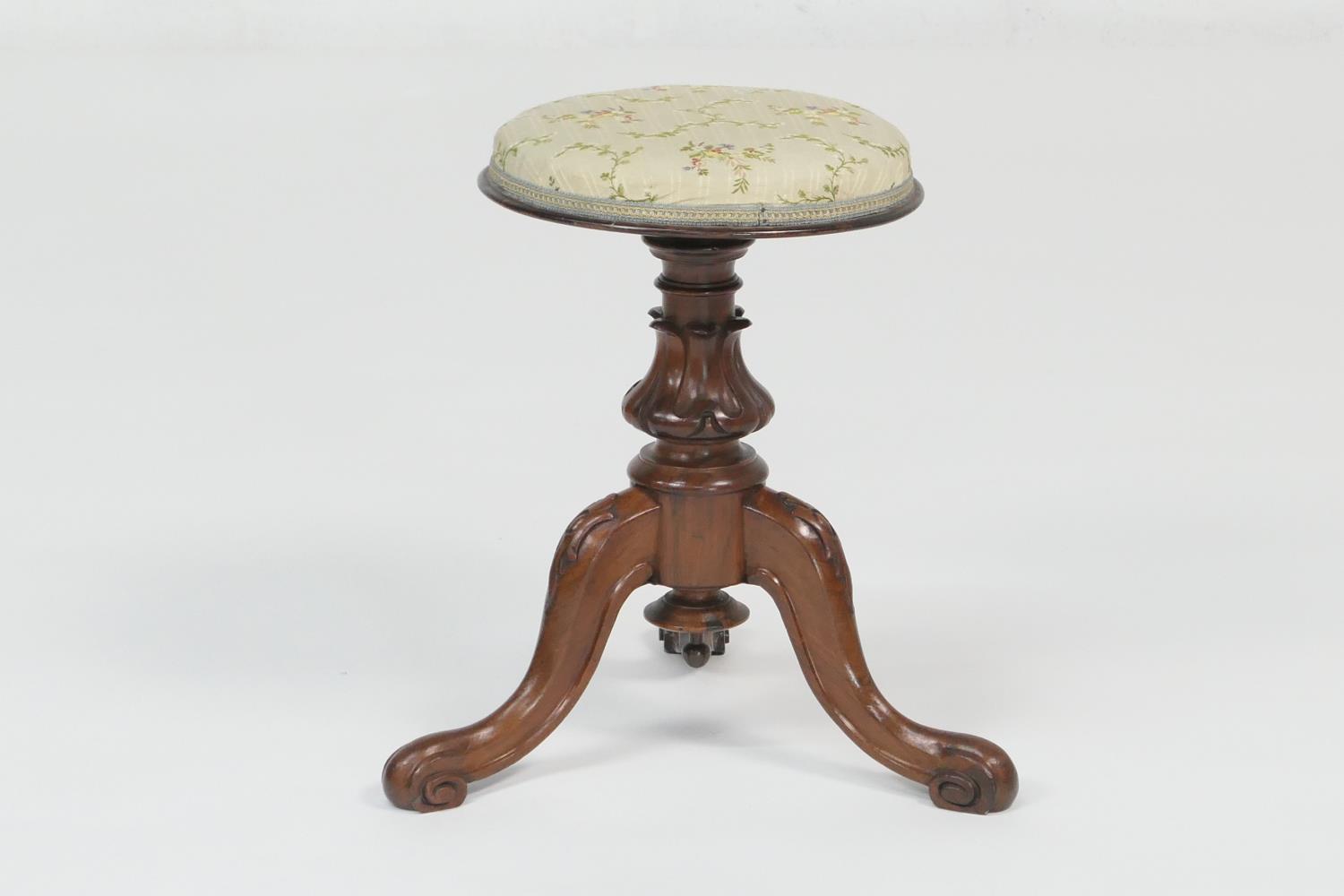 Victorian rosewood rise and fall piano stool, circa 1845, the circular pad seat upholstered in