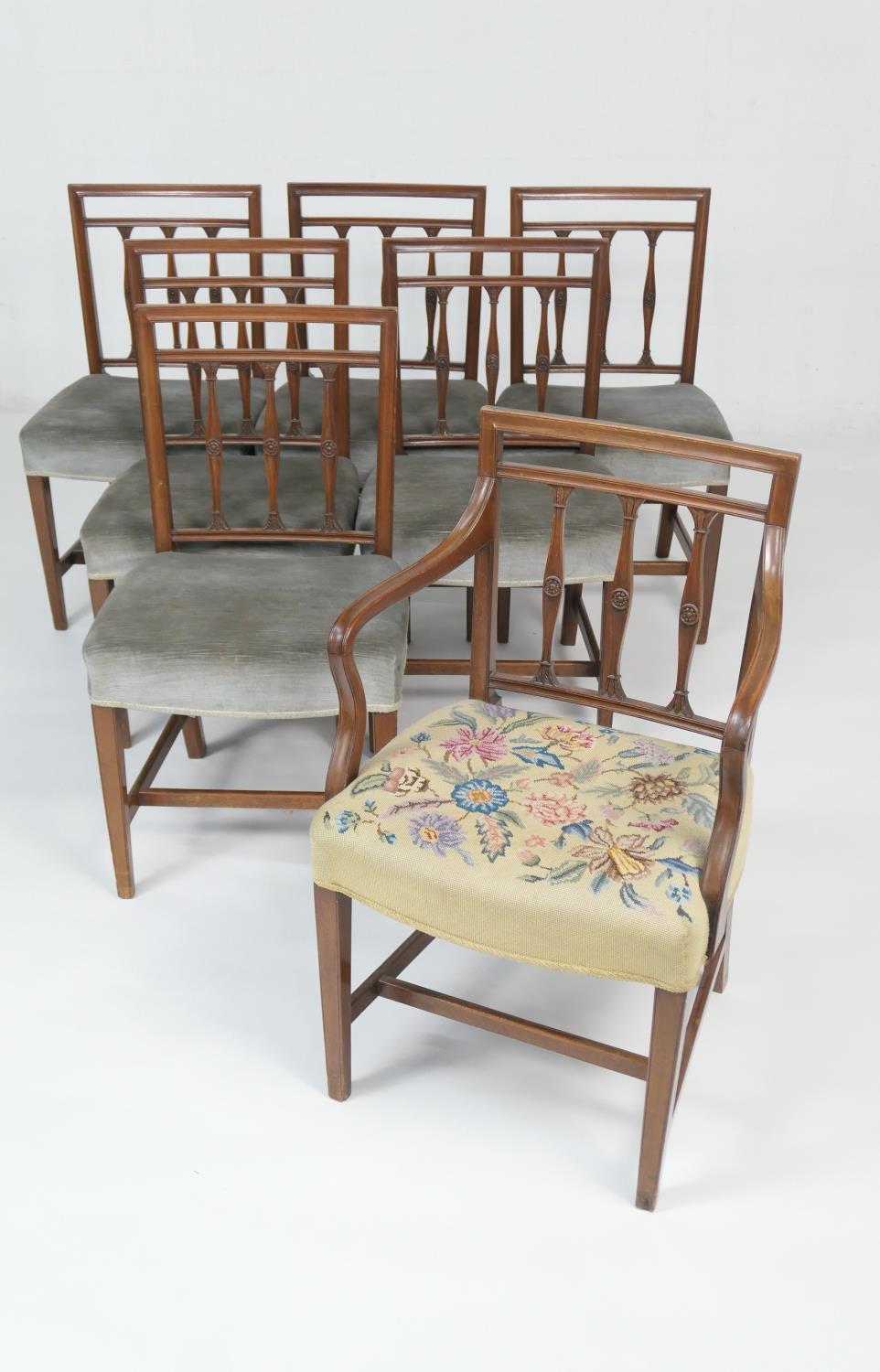 Set of seven mahogany dining chairs (6 + 1), 19th Century, with three acanthus carved and rosette