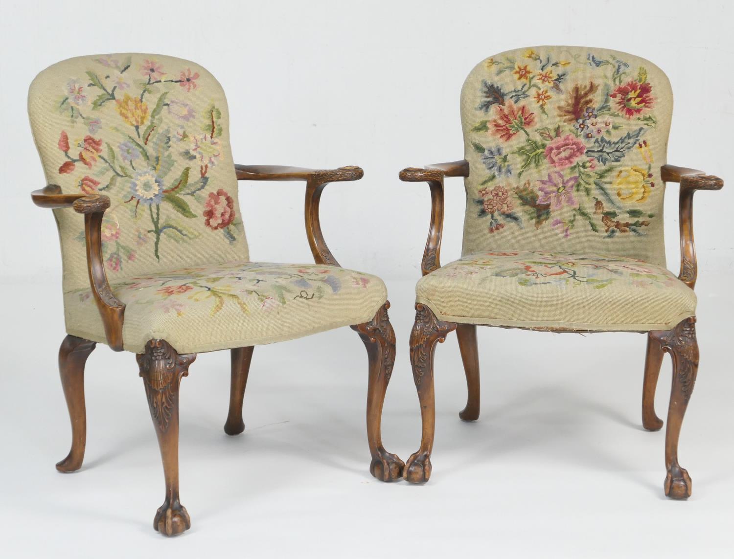 Pair of walnut and upholstered open armchairs, in the early Georgian style, the back and seat in